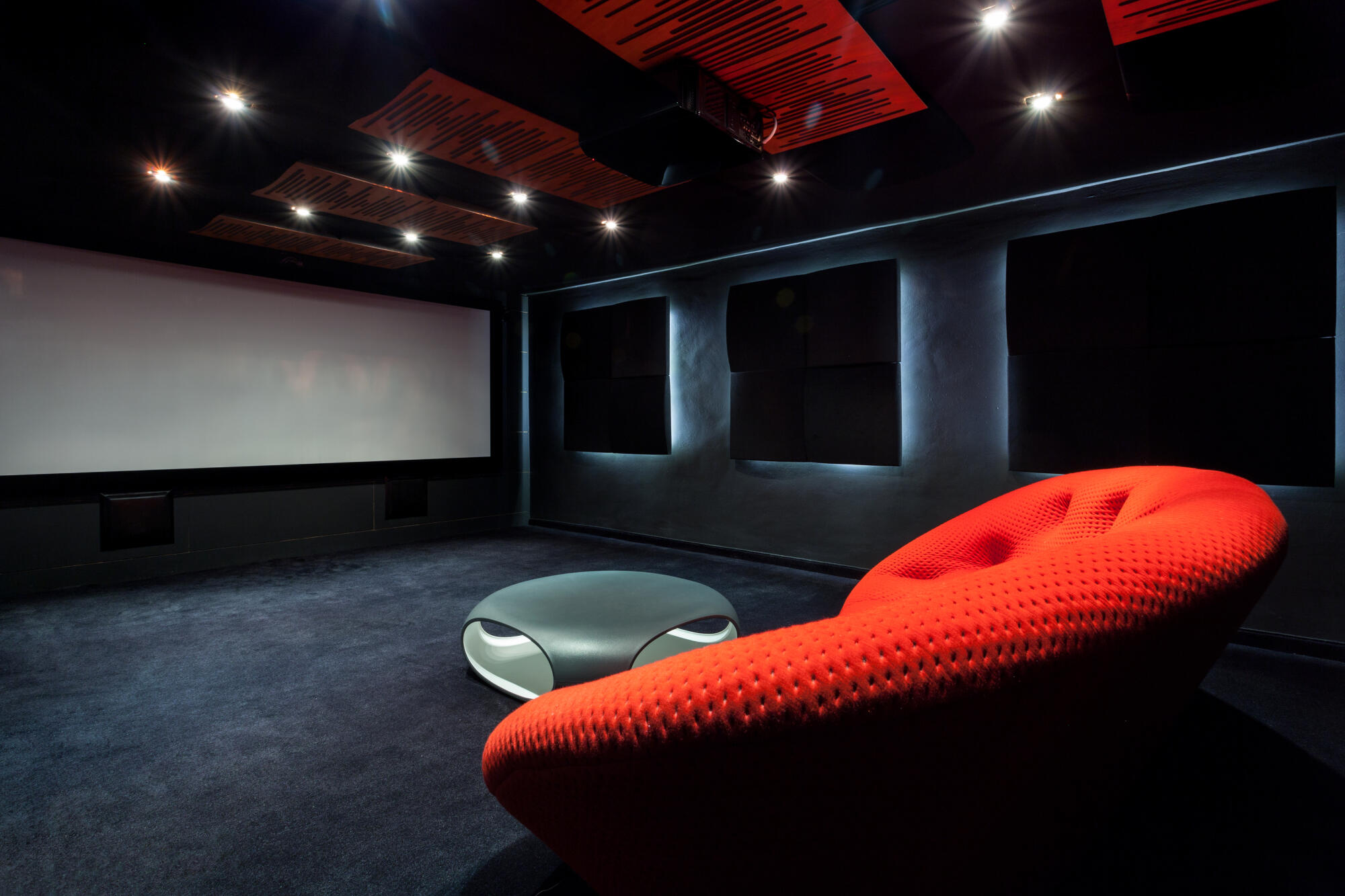 Comfortable-red-sofa-in-a-dark