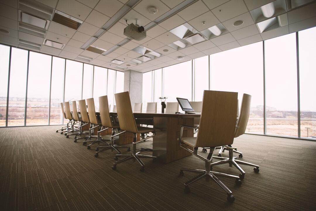 oval-brown-wooden-conference-t